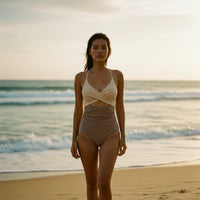 Beige ribbed tank top with criss-cross straps on a white background