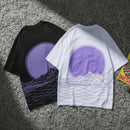 Black and white t-shirts with purple circular design on a textured surface