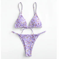 Purple floral bikini set on a white background