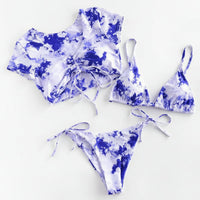 Blue and white tie-dye bikini set on a white background