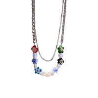 Necklace with floral beads on a white background