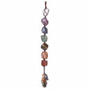 A multicolored beaded necklace with a geometric pattern, featuring various shaped beads and a brown string.