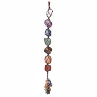 A multicolored beaded necklace with a geometric pattern, featuring various shaped beads and a brown string.