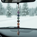 Necklace with multicolored stone beads on a white background