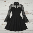 Black dress with sheer sleeves on a white background