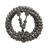 Black beaded bracelet with clasp on a white background
