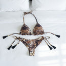 Leopard print bikini set with tassels on a white surface