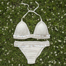 Beige crochet bikini set with sequin details on a checkered background