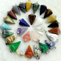 Assorted crystal pendulums in various colors on a white background