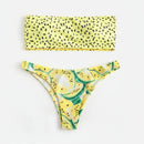 Yellow bikini set with leaf pattern on a white background