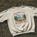 White sweatshirt with Yellowstone National Park design on grass