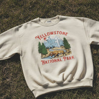 White sweatshirt with Yellowstone National Park design on grass