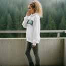 White hoodie with 'Brooklyn New York' text on a textured surface