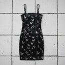Black dress with butterfly pattern on a checkered background