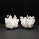 Two crystal formations on a dark background