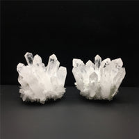 Two crystal formations on a dark background