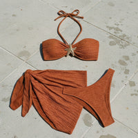 Brown bikini set with starfish detail on a white background