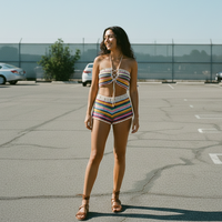 Colorful striped crochet top and shorts set on a model with an outside background