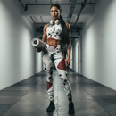 Camouflage-patterned tank top and leggings set in a gym background