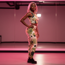 Person in a colorful outfit dancing in a pink-lit room