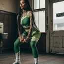 Person wearing a green and white sports outfit in an indoor setting