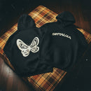 Two black hoodies with a butterfly design and 'Nostalgia' text on a plaid surface.