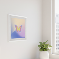 A fine art print featuring an abstract image of a butterfly in a colorful, matte finish frame.